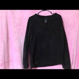 Black sweater unusual has sparkles in it